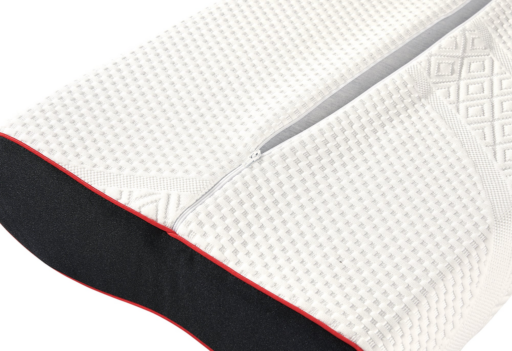 Close-up of a textured mattress with a zipper detail on a white background
