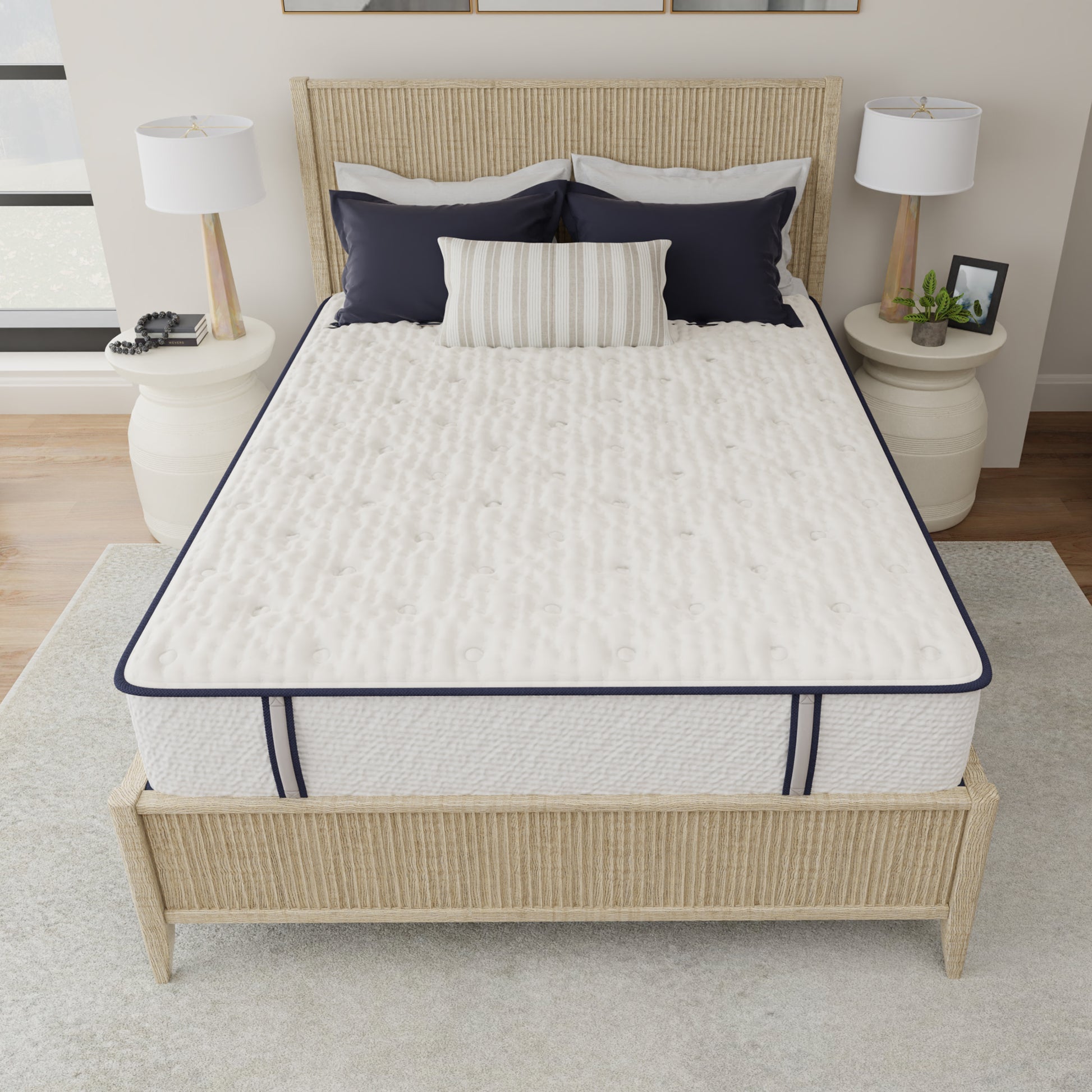 Mattress on a bed with wicker headboard and nightstands in a bedroom setting
