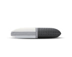 A modern capsule-shaped travel pillow with a white and light gray fabric-covered half and a dark gray perforated foam half, shown horizontally on a white background.