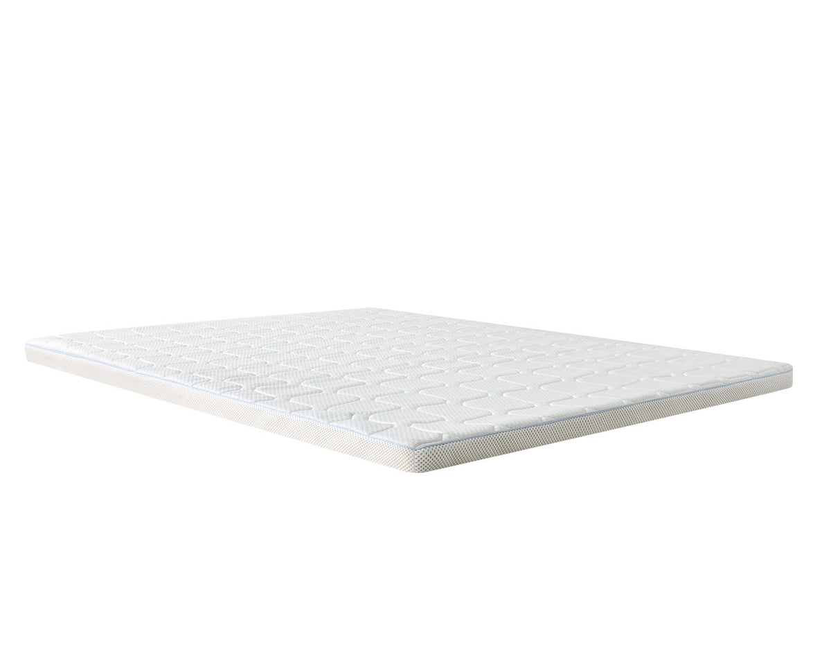 A white mattress topper with a quilted geometric pattern on top and a textured edge, shown floating at an angle against a solid white background.