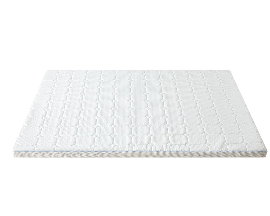 A white mattress topper or mattress pad with a quilted geometric pattern, shown from a high angle on a solid white background.