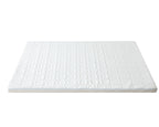 A white mattress topper or mattress pad with a quilted geometric pattern, shown from a high angle on a solid white background.