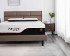 An MLILY mattress shown on a bed in a modern bedroom setting. The mattress features a white quilted top, a black side panel with the MLILY logo, and a red accent line.